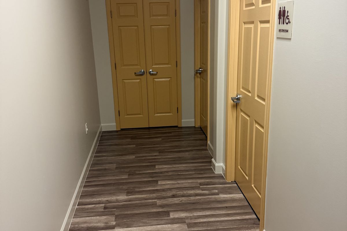 Finished hallway with new flooring and paint