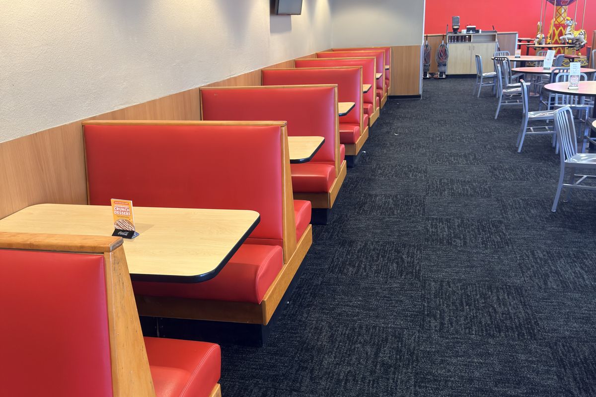 New carpet and cove base detailed into the booths